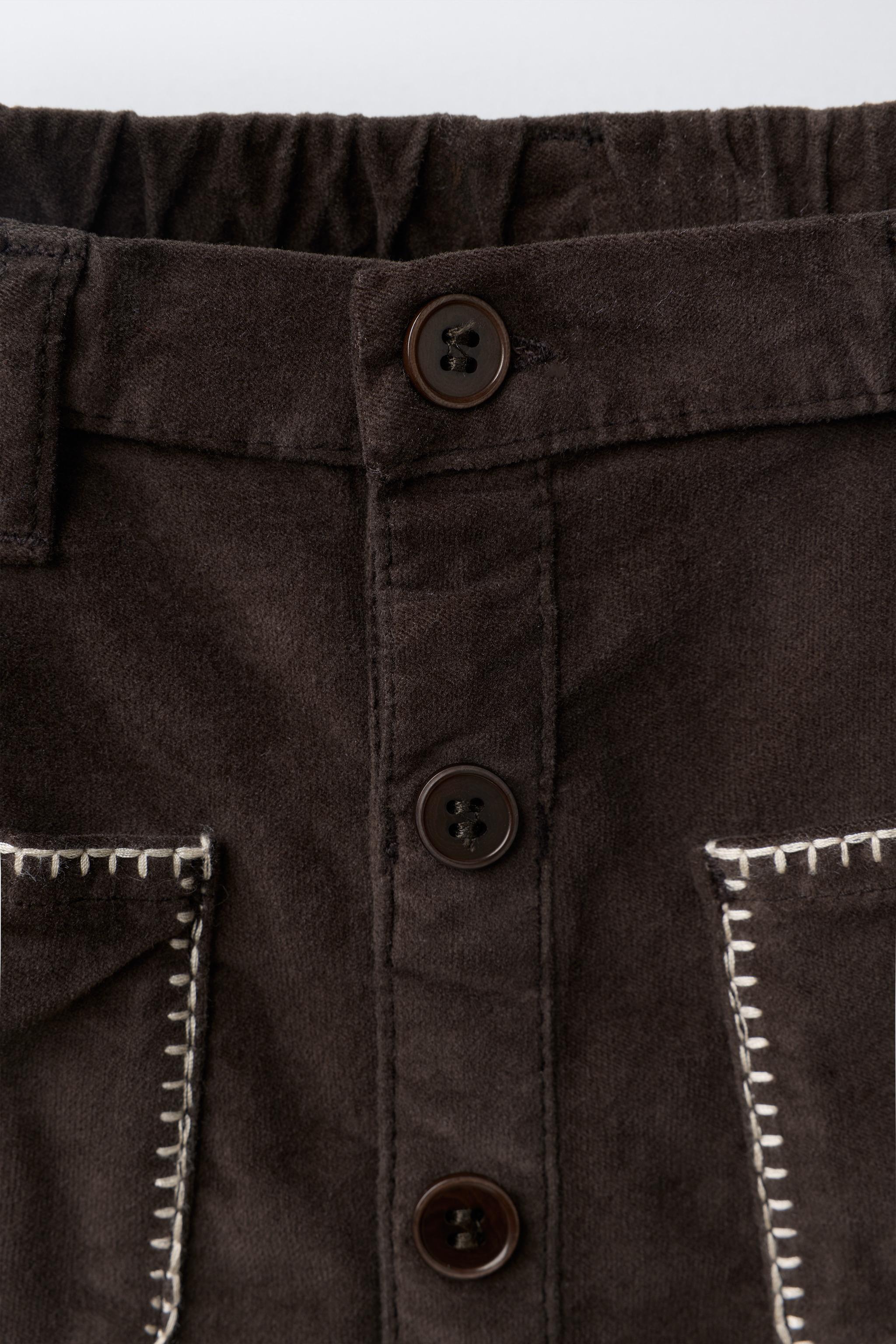 JUPE EN VELOURS À POCHES LISERÉES